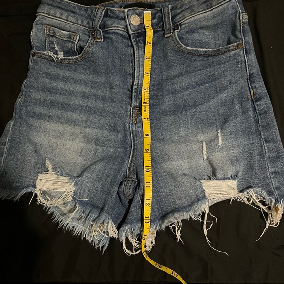 Risen high rise. Distressed jean shorts. - Picture 7 of 9